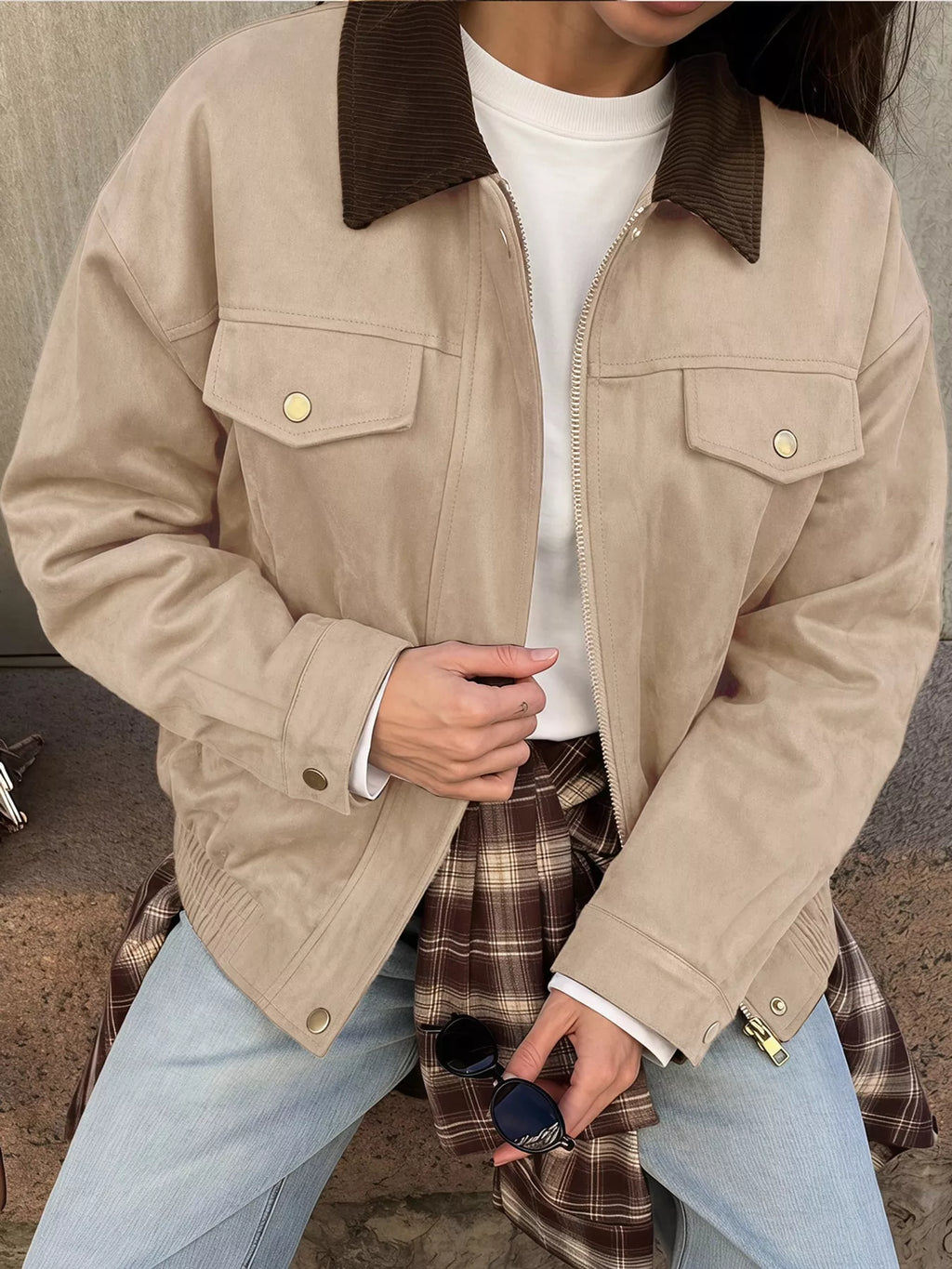 Apricot jacket styled open with jeans.