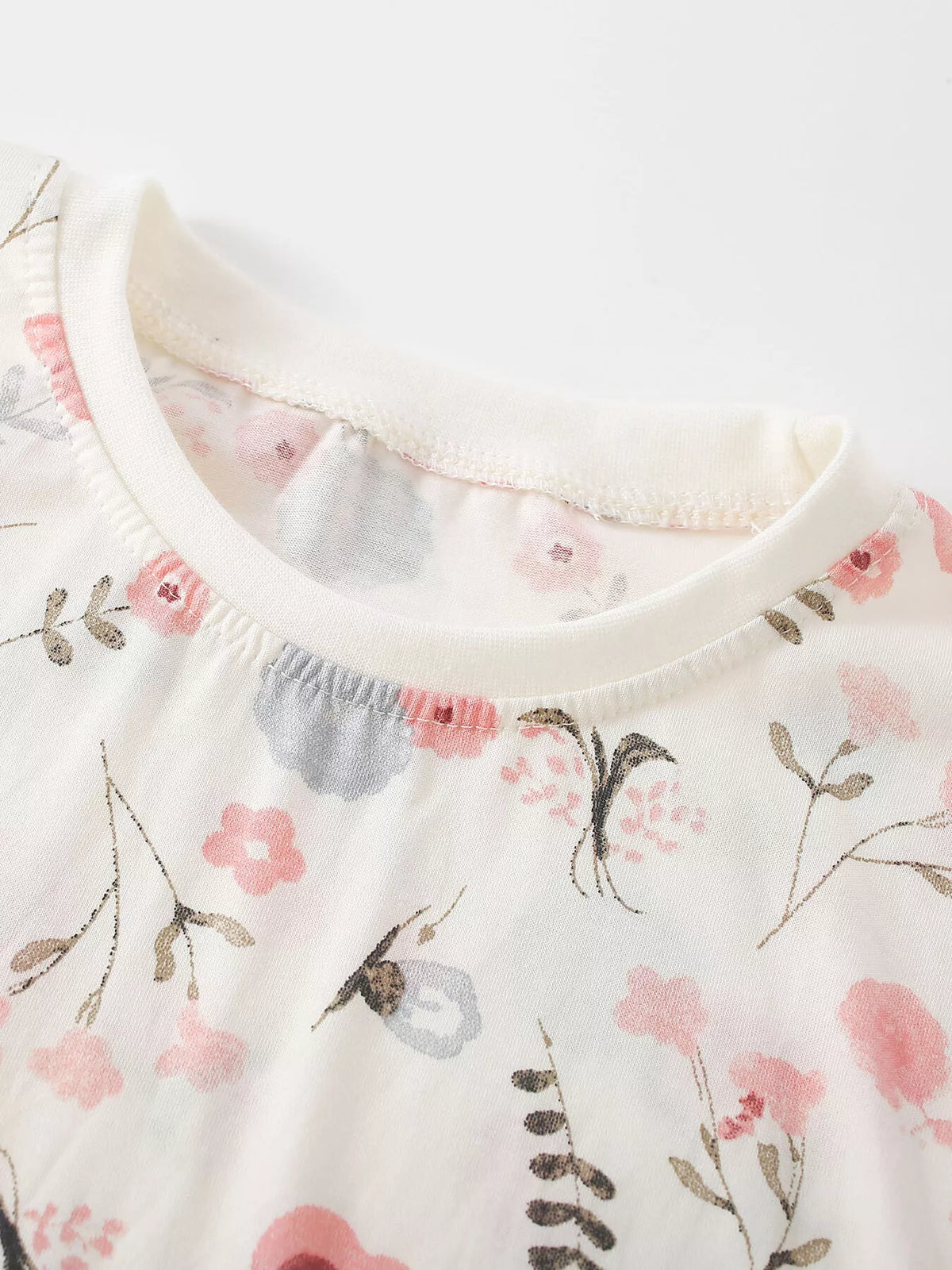 Ribbed cream neckline and pastel floral print on the children’s sweatshirt