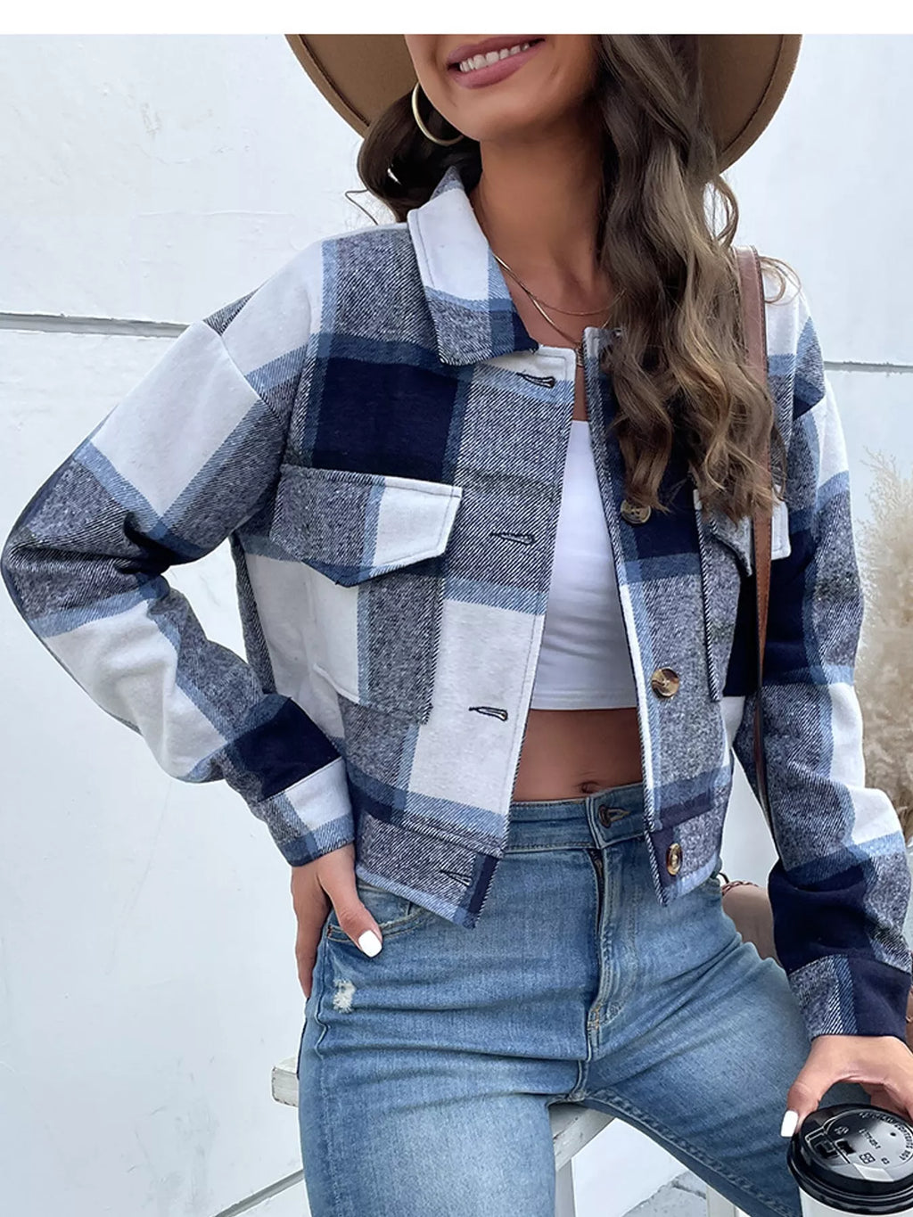 Navy color-block plaid cropped jacket with flap chest pockets, front view.