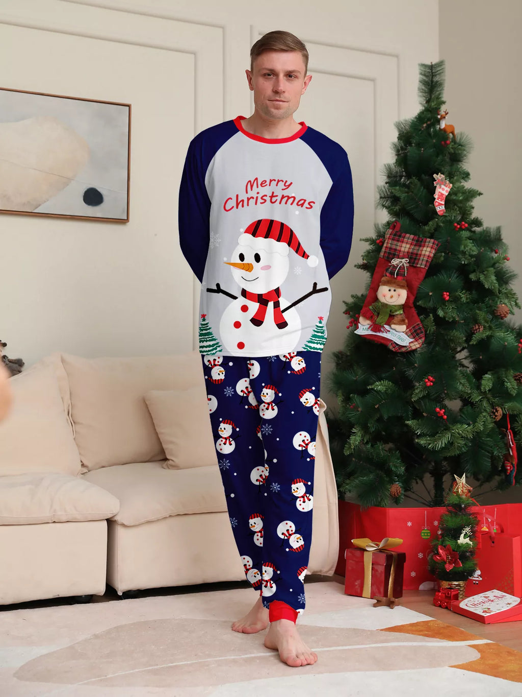 Front view of the men's navy-and-white snowman Christmas pajamas.