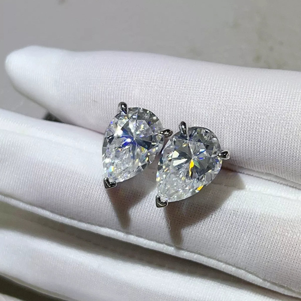 Silver-tone stud earrings with triangular clear stones — detail view