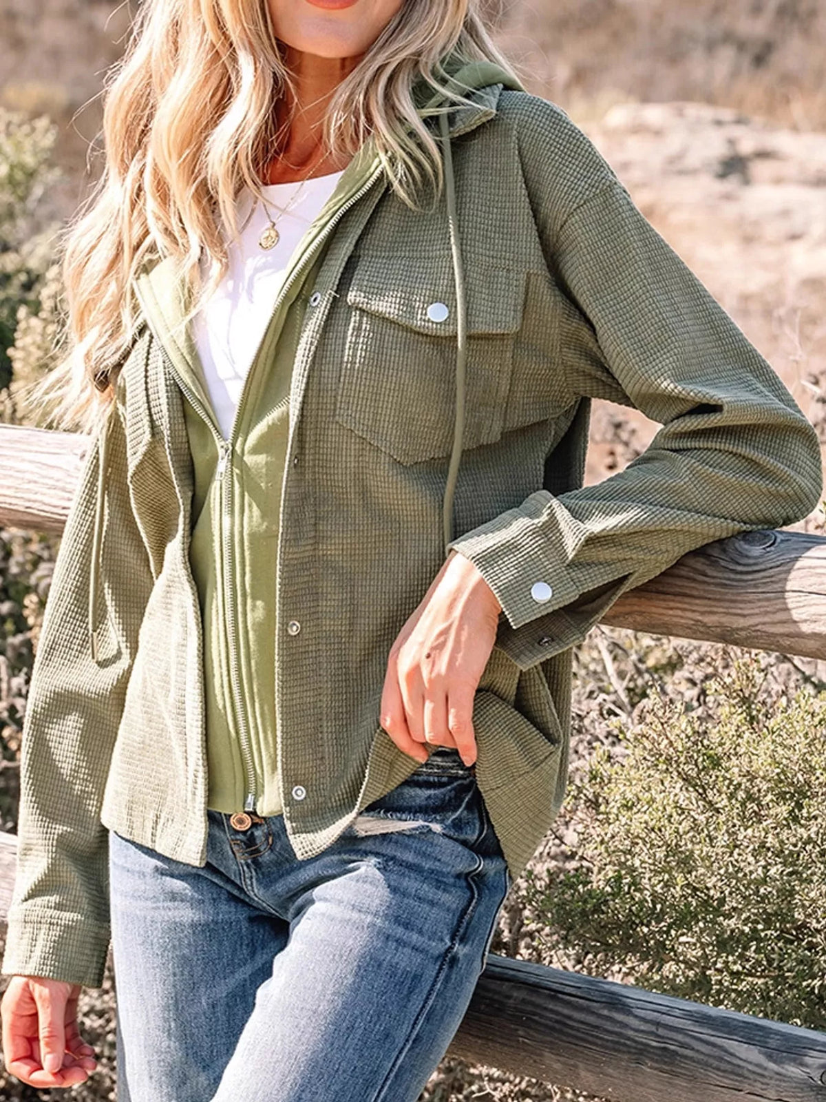 Matcha-green textured hooded jacket with chest pockets, front view.
