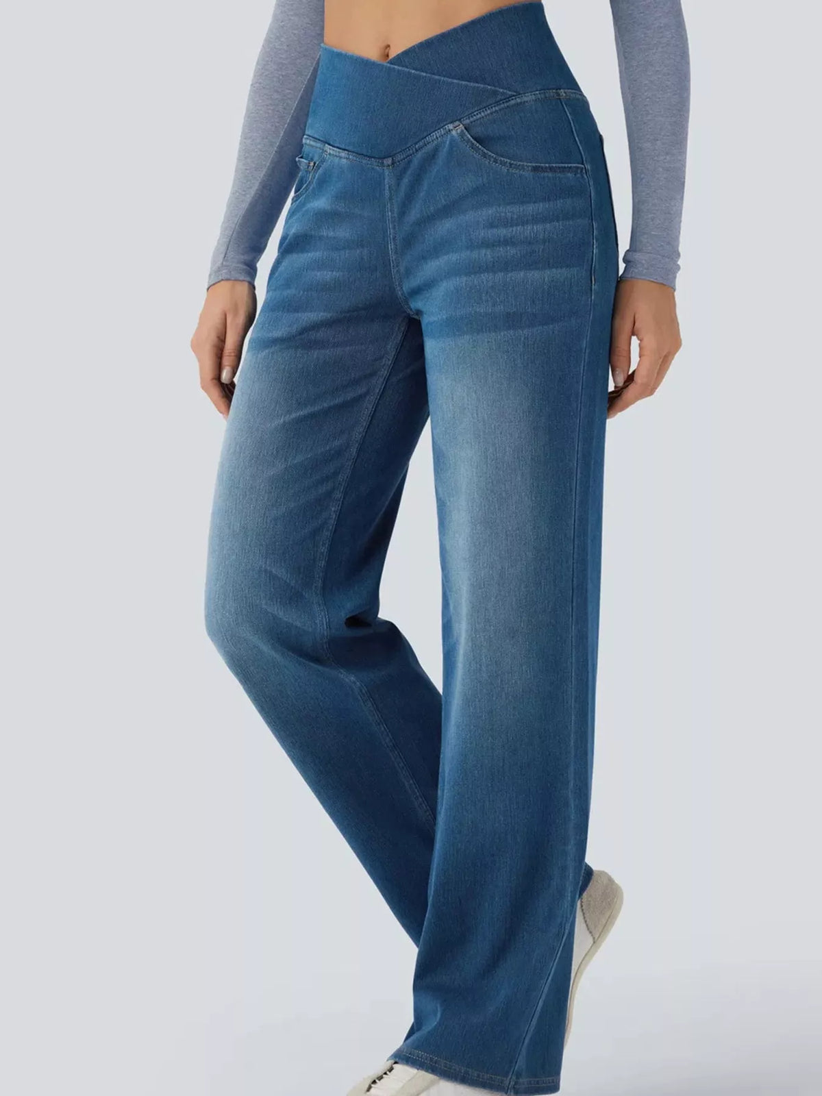 Light blue high-waisted crossover waistband straight-leg jeans — detail view