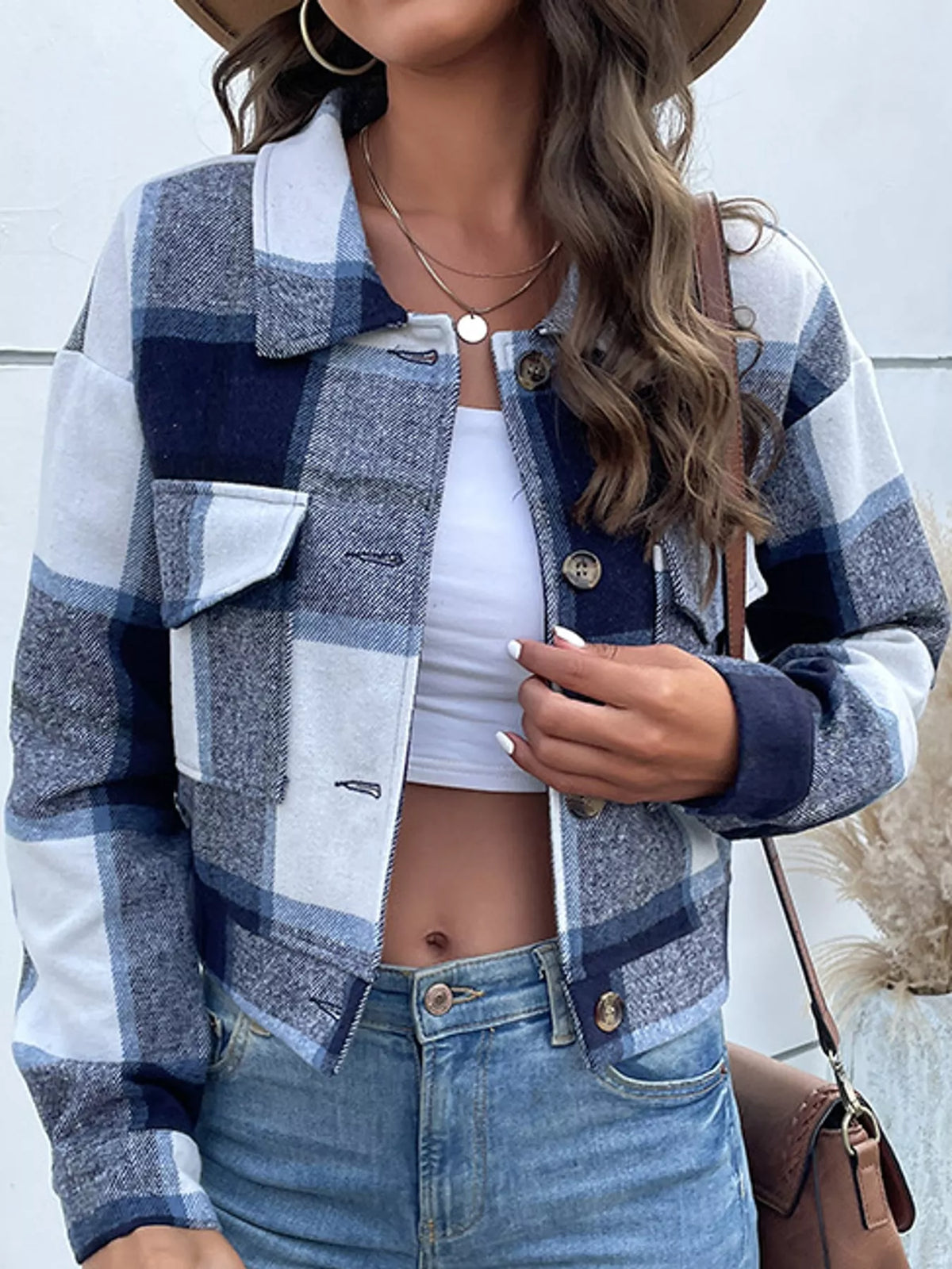Navy color-block plaid cropped jacket with flap chest pockets, front view.
