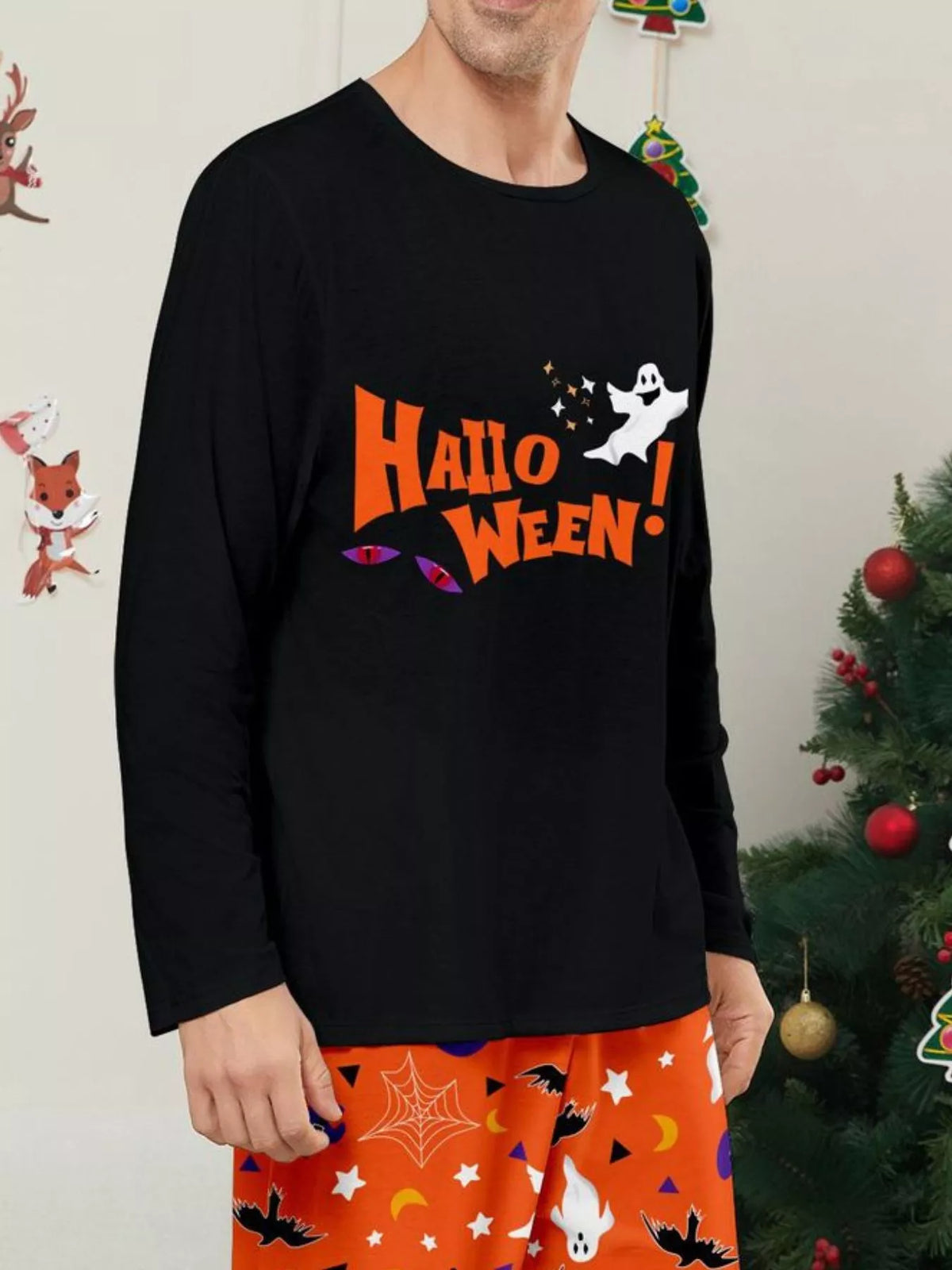 Close view of the Halloween lettering and ghost graphic on the black pajama top.