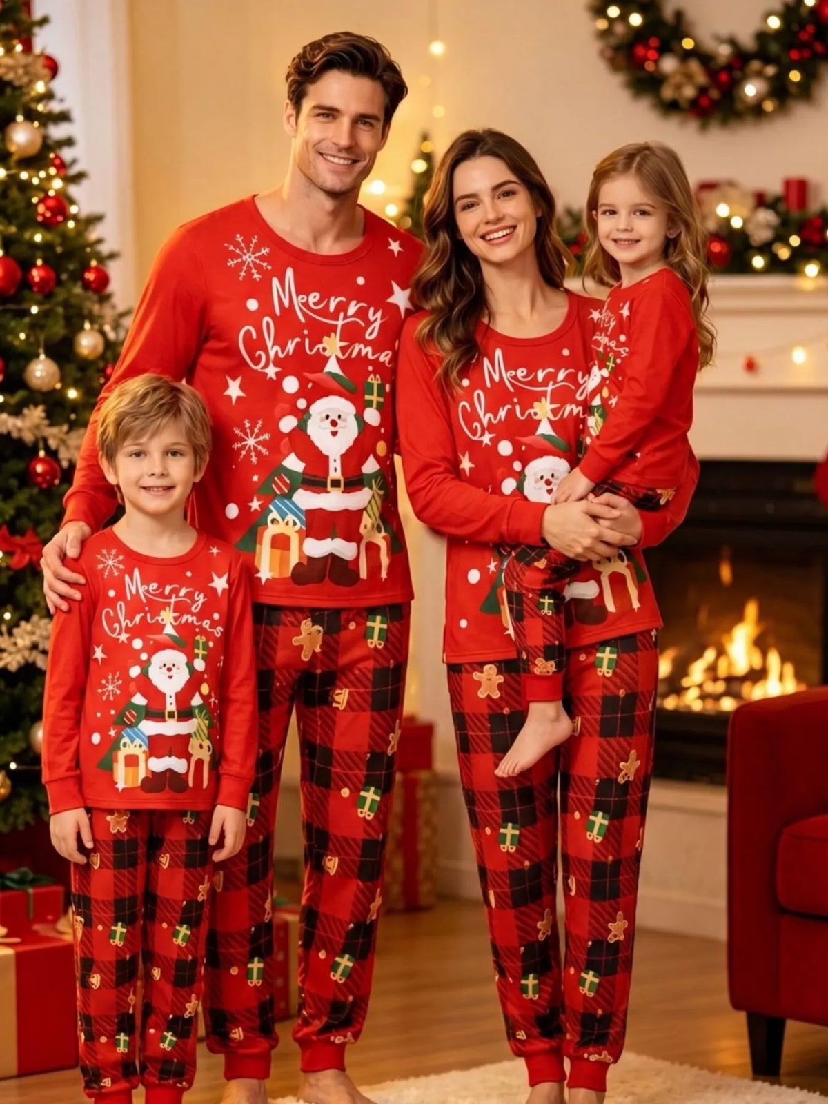 Family modeling the red Christmas graphic tops and red plaid pajama pants.
