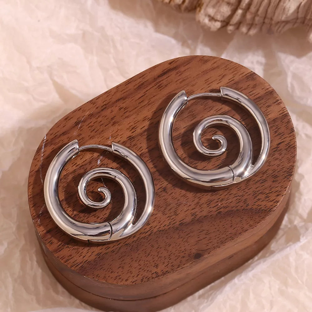 Silver-tone spiral hoop earrings — detail view
