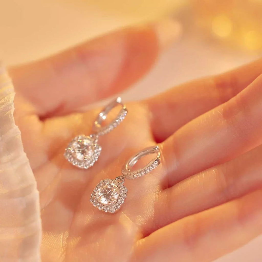 Silver-tone hoop earrings with square halo stone drops — detail view