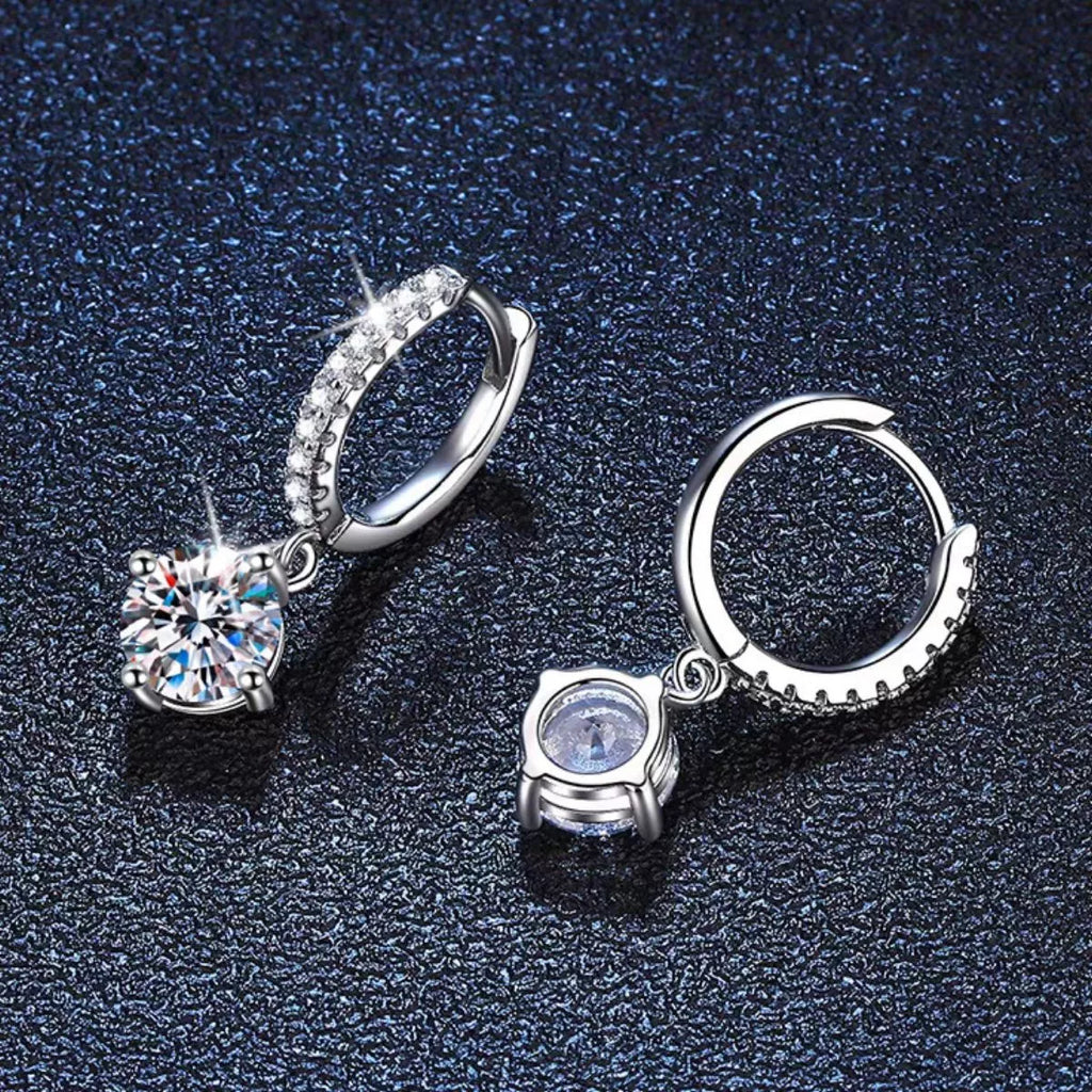 Silver-tone hoop earrings with round halo stone drops — detail view