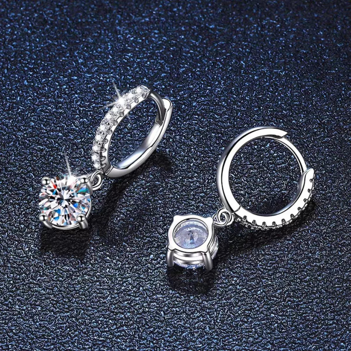 Silver-tone hoop earrings with round halo stone drops — detail view