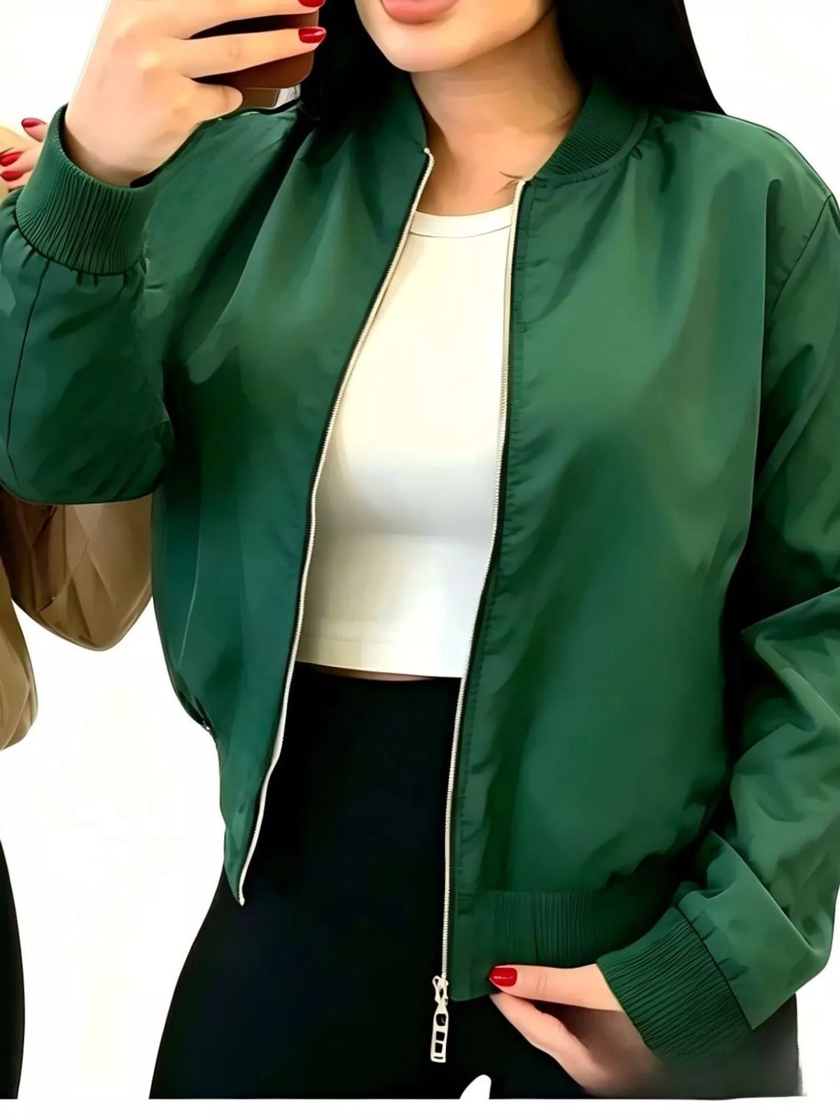 Green zip-up bomber jacket modeled open over a white top.