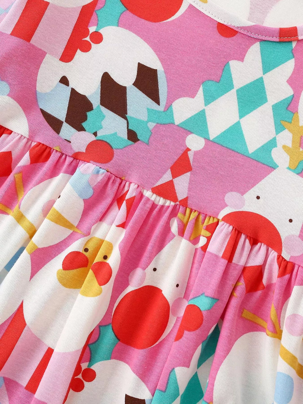 Gathered waist and Christmas ornament print on the pink dress