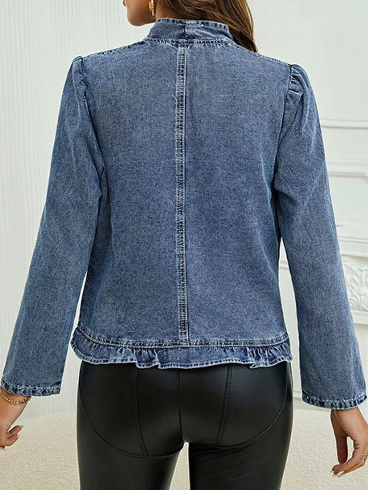 Back view of the blue washed open-front jacket.
