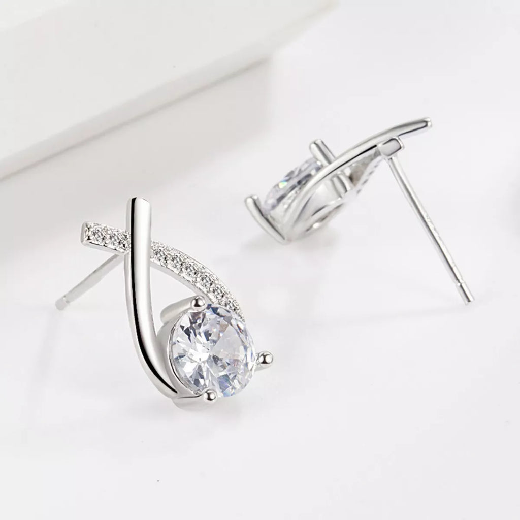 Silver-tone open teardrop earrings with round clear stones — detail view