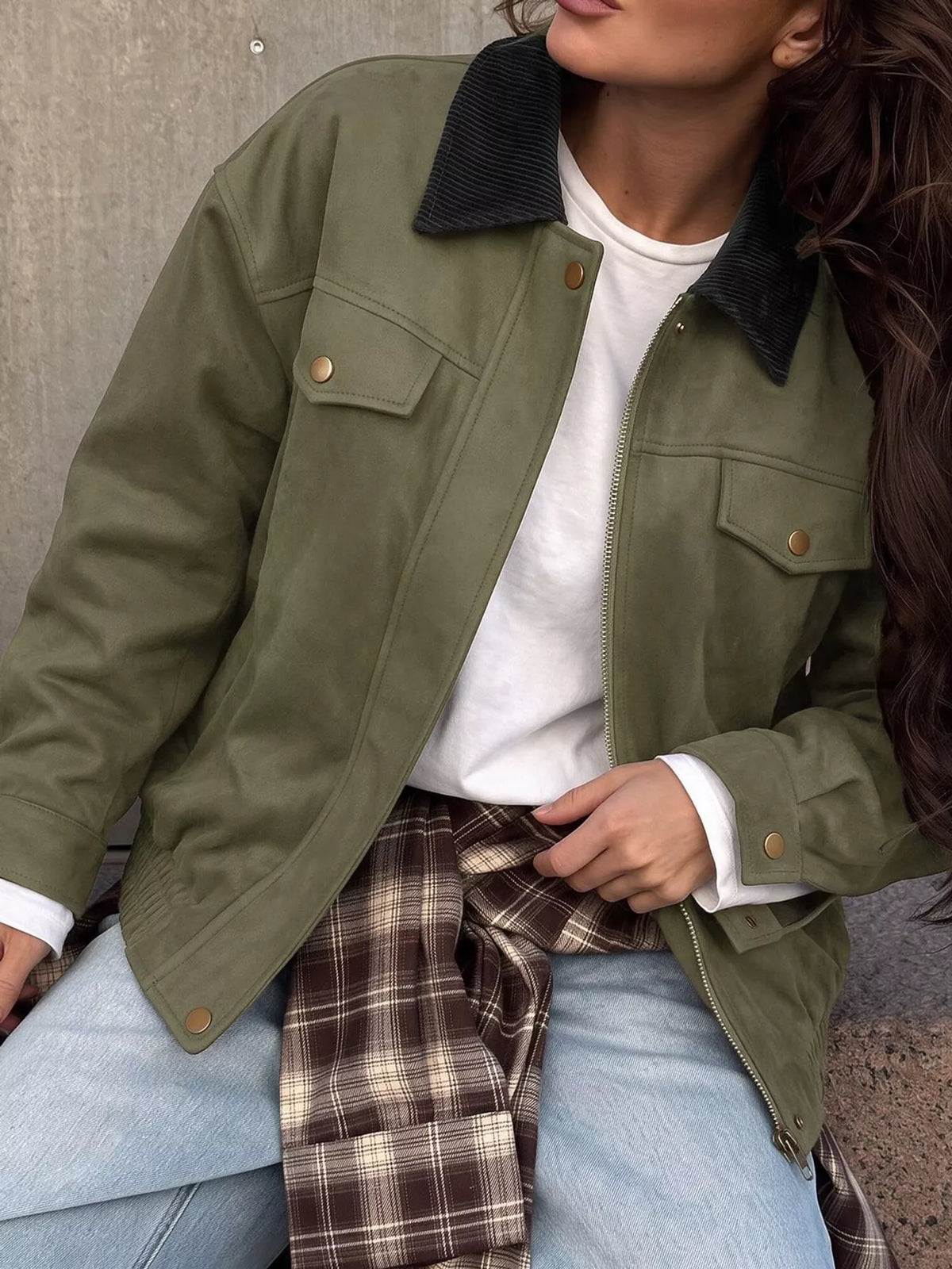 Close front view of the army-green jacket's collar and pockets.