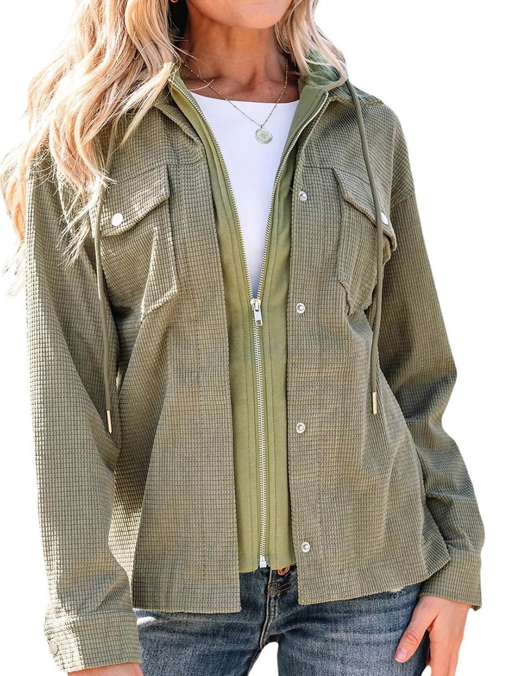 Front view of the green jacket's zip front and snap-button placket.