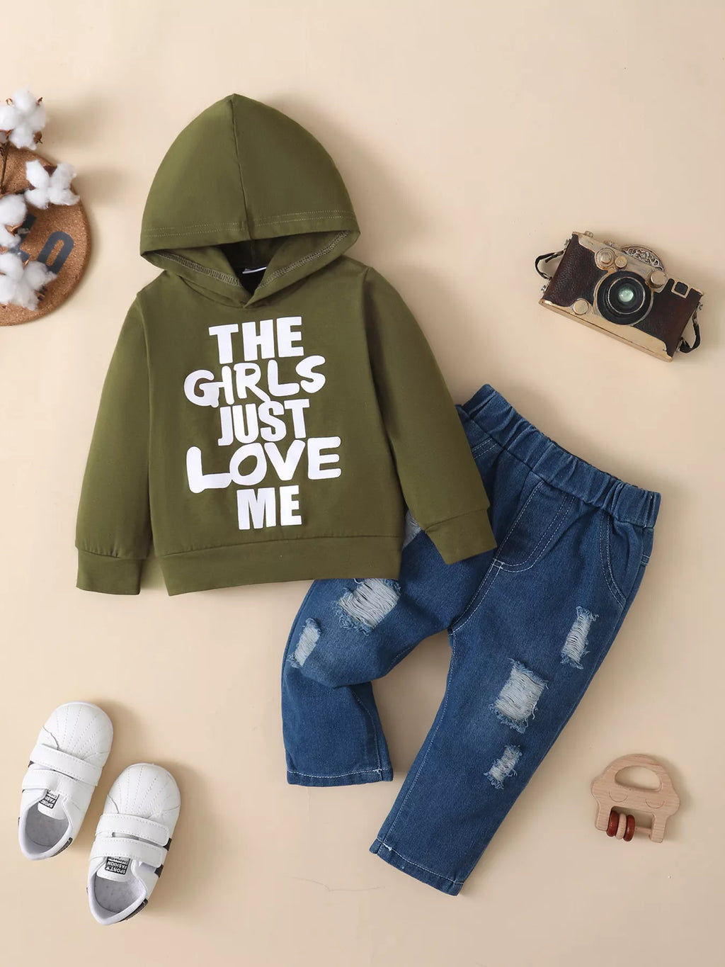 Children’s olive graphic hoodie and distressed blue jeans displayed flat
