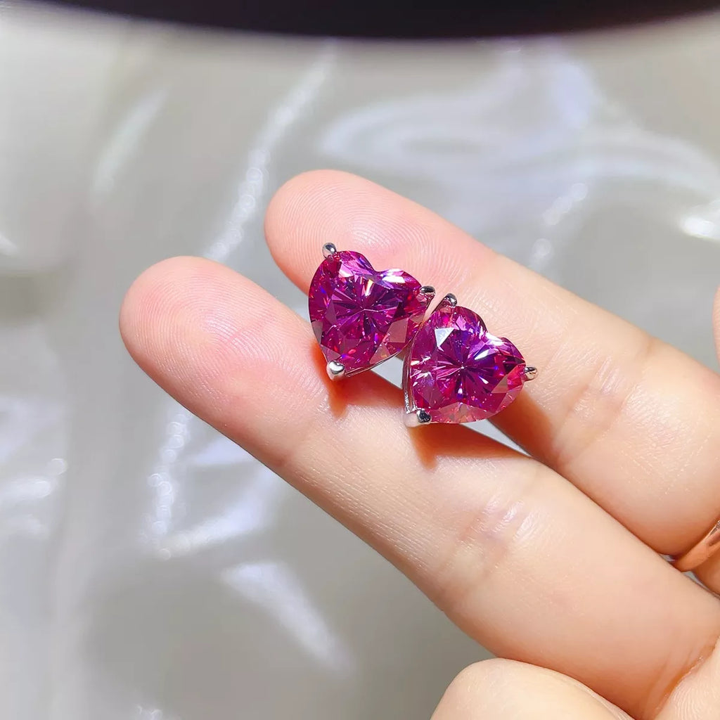 Pink heart-shaped gemstone stud earrings — detail view