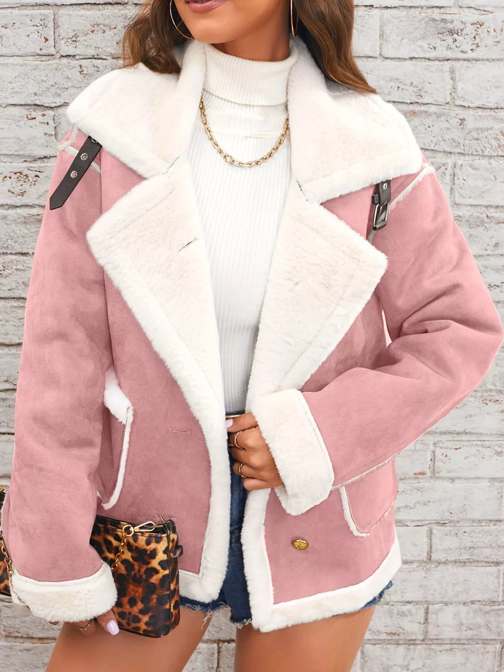 Pink jacket with wide white plush lapels, contrast trim and front pockets, front view modeled worn open.