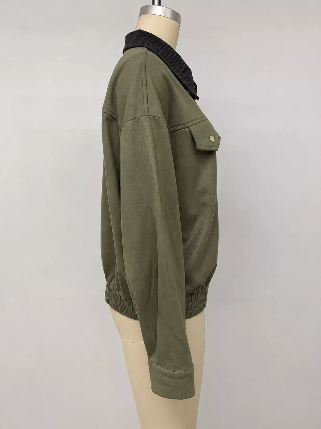 Side view of the army-green jacket on a mannequin.