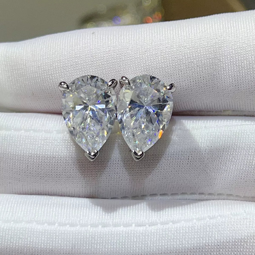 Silver-tone stud earrings with triangular clear stones — detail view