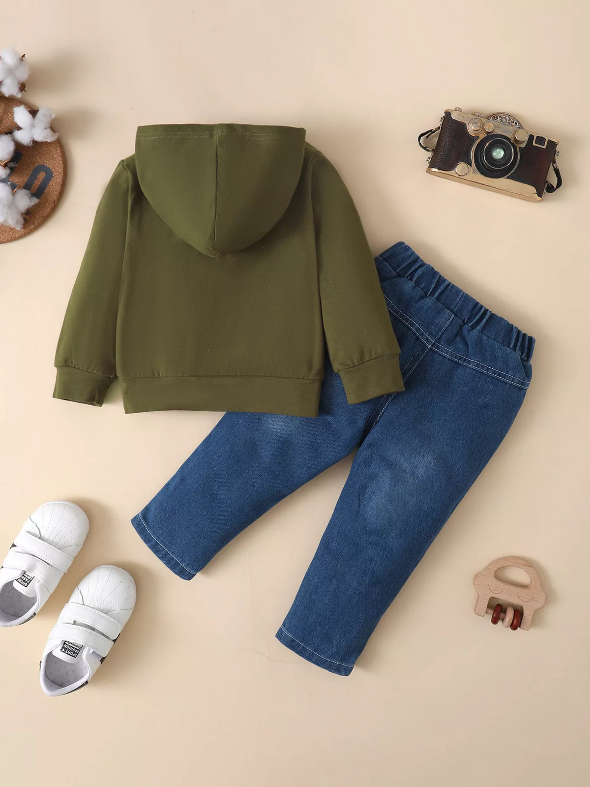 Children’s olive graphic hoodie and distressed blue jeans — back view
