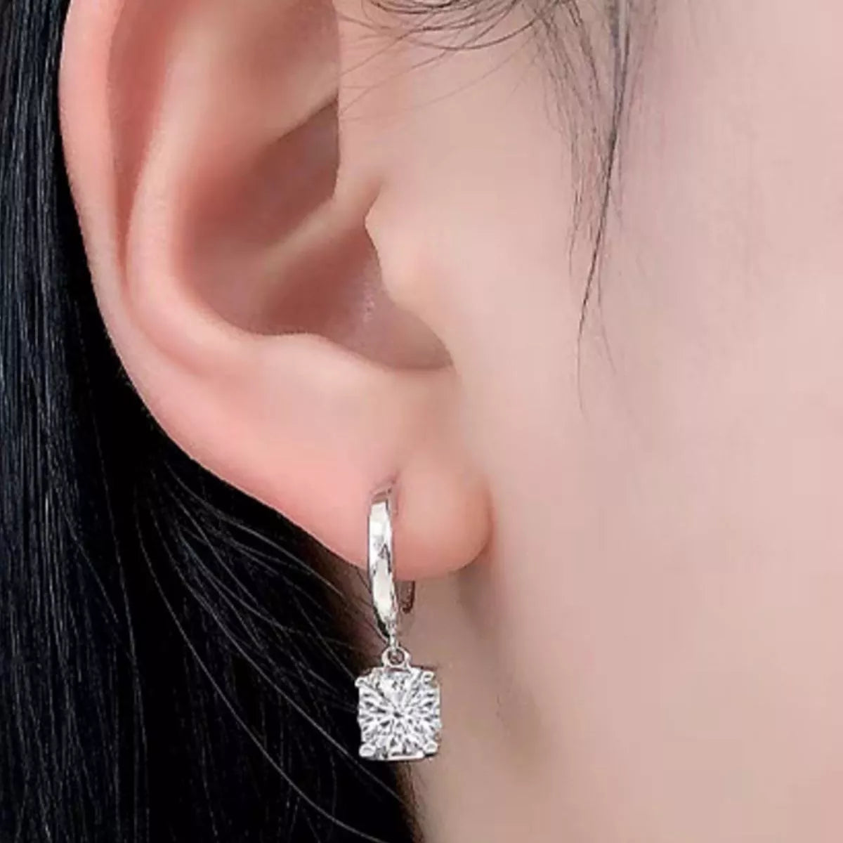 Silver-tone hoop earrings with square clear stone drops — detail view