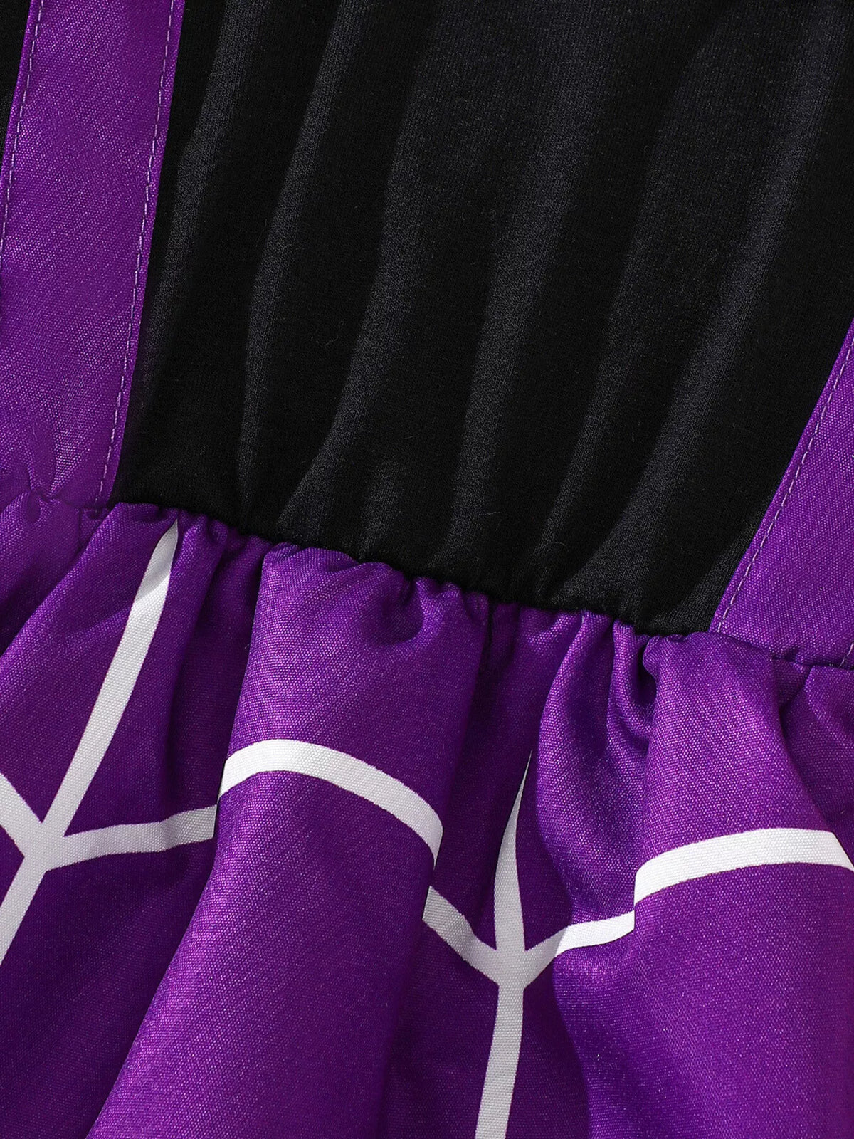 Close-up of the black bodice and gathered purple spiderweb skirt waist.