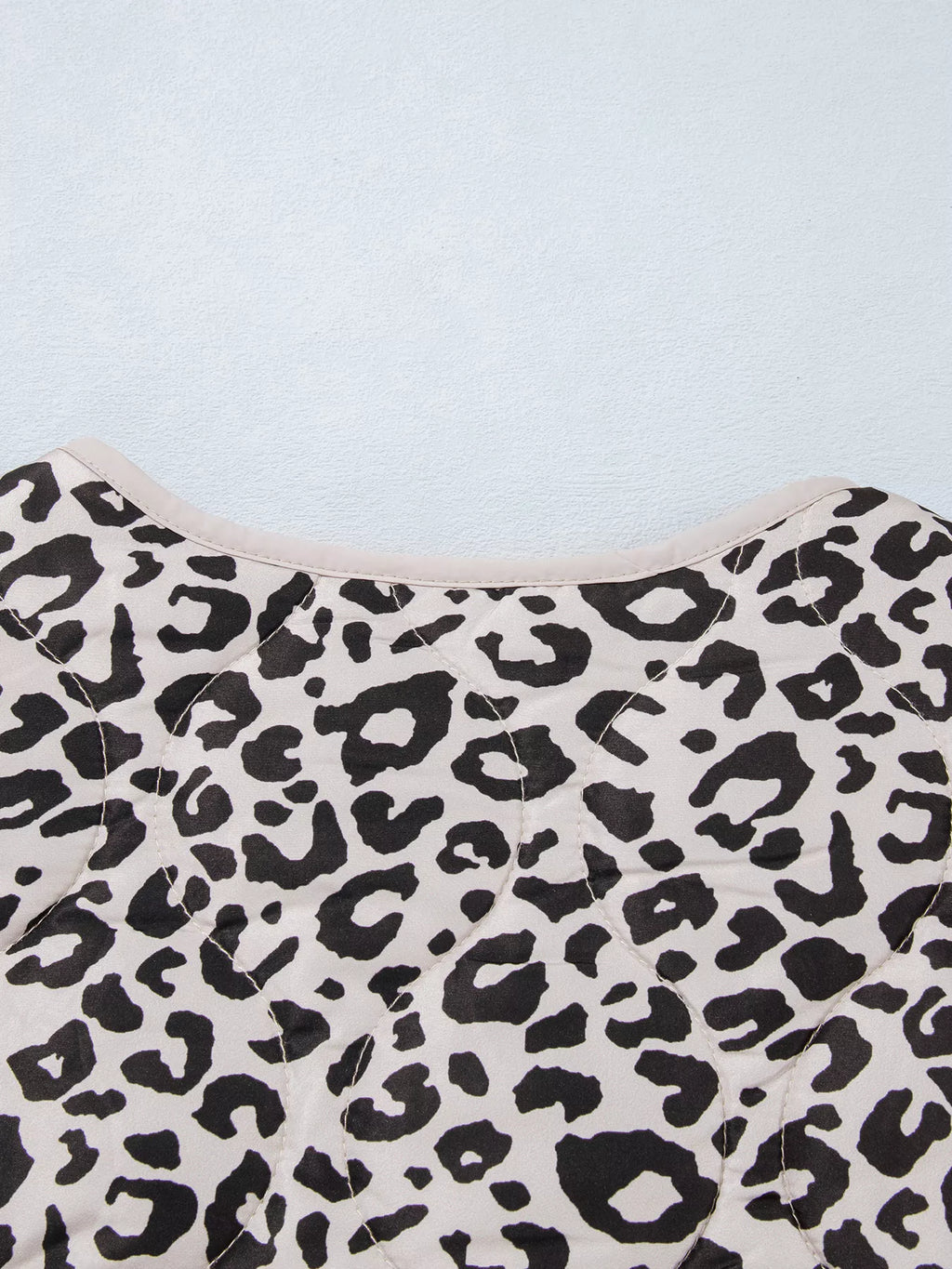 Close-up of the leopard-print jacket's back neckline.