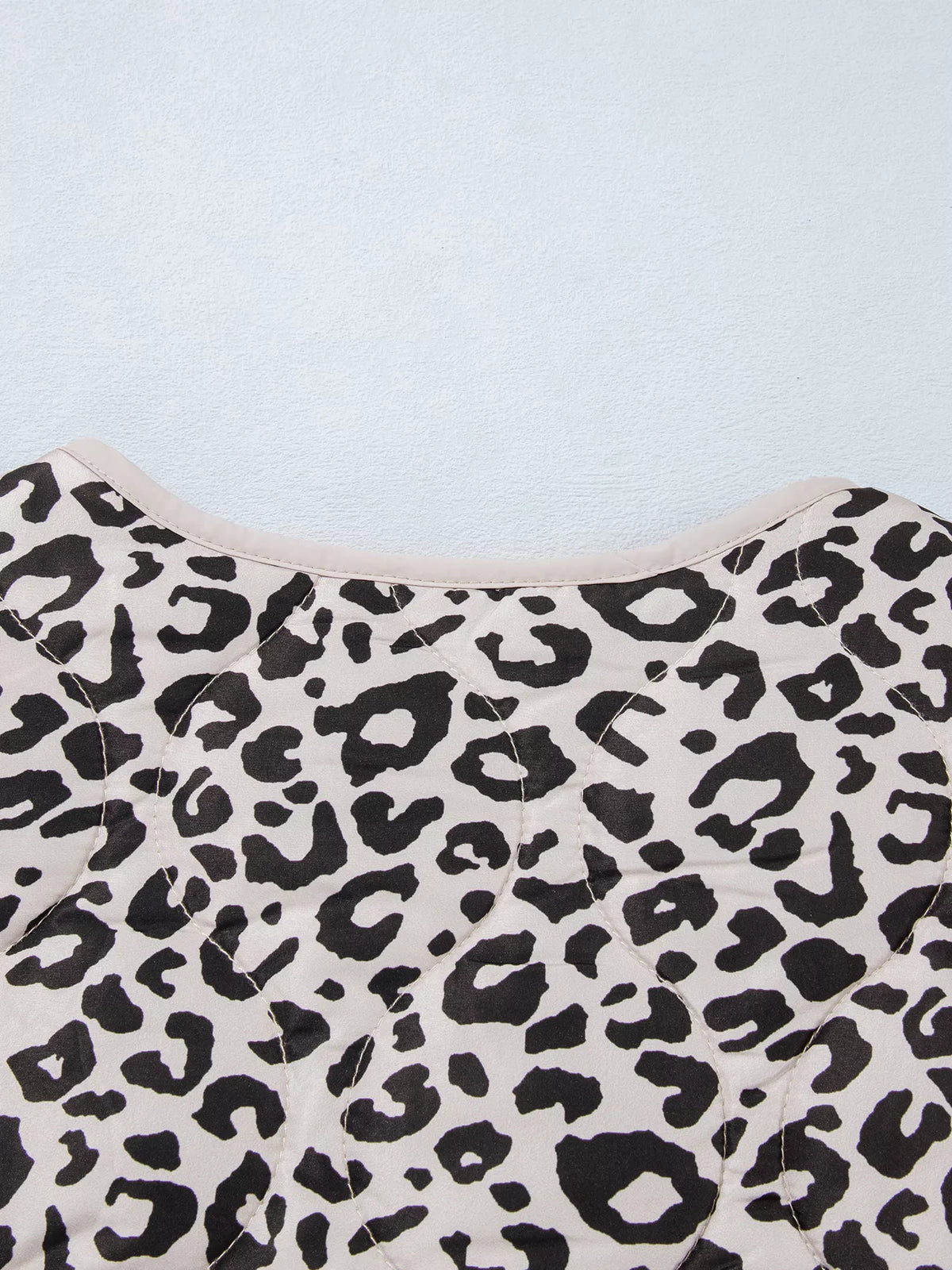 Close-up of the leopard-print jacket's back neckline.