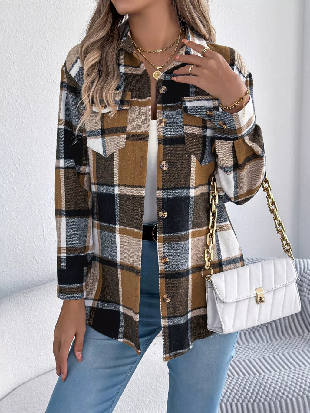Khaki plaid button-down shacket with chest pockets, front view.