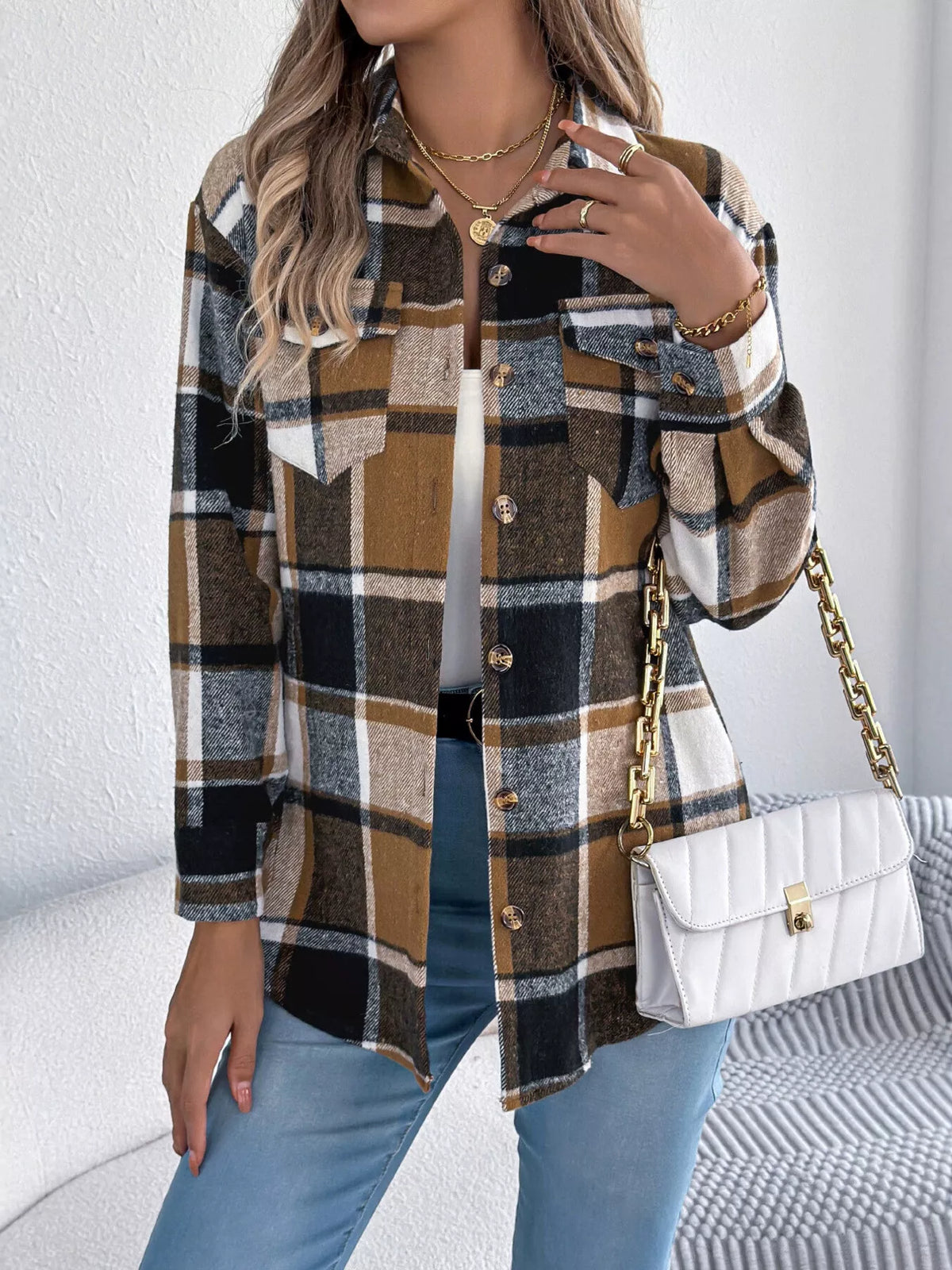 Khaki plaid button-down shacket with chest pockets, front view.