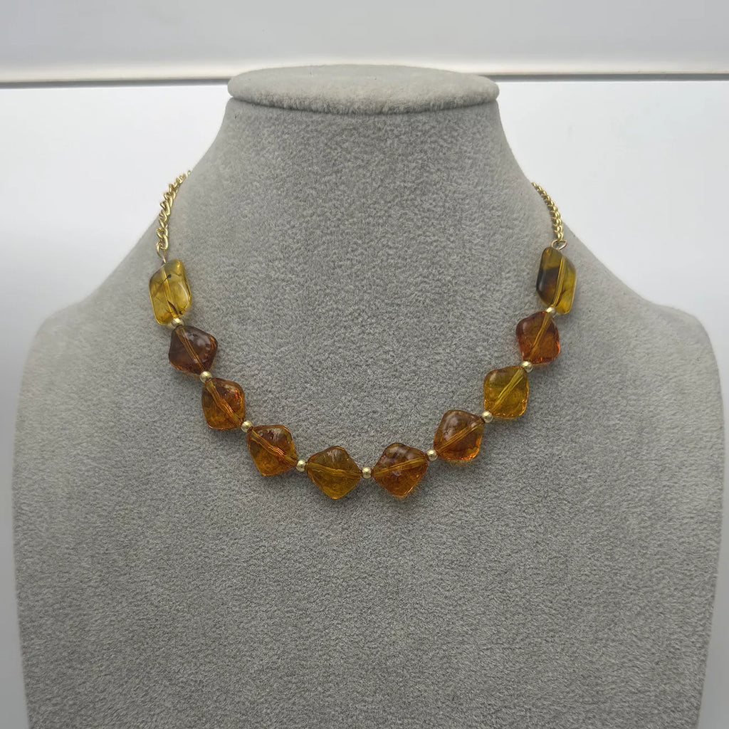 Gold-tone necklace with angular amber-colored beads