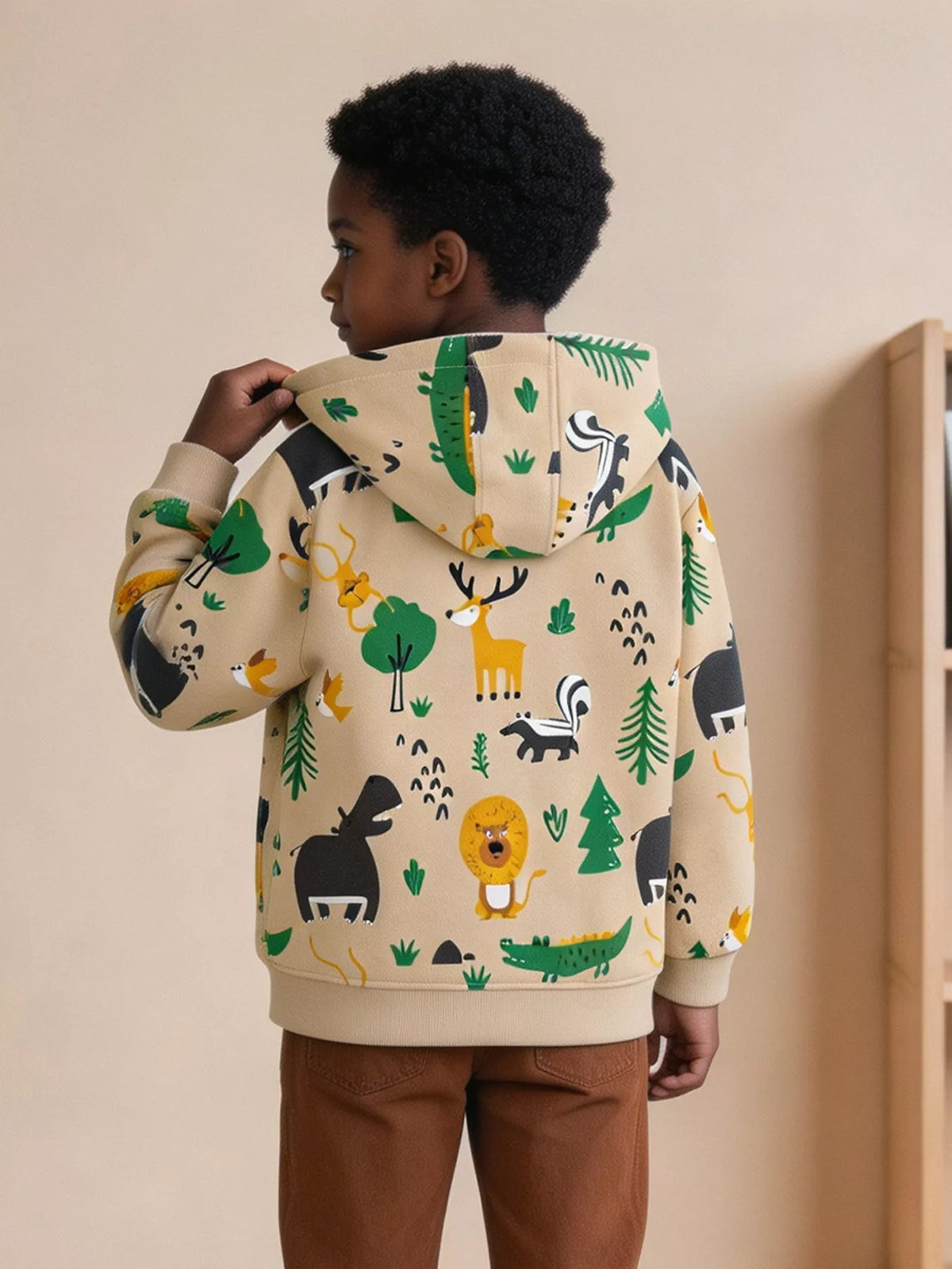 Back of the beige forest-animal print hooded jacket worn by a child