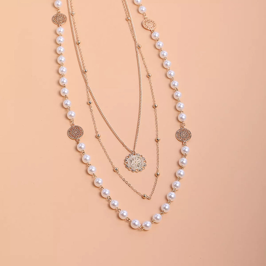 Layered pearl-like bead and coin pendant necklace — detail view