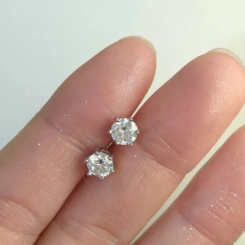 Silver-tone round clear stone stud earrings — detail view