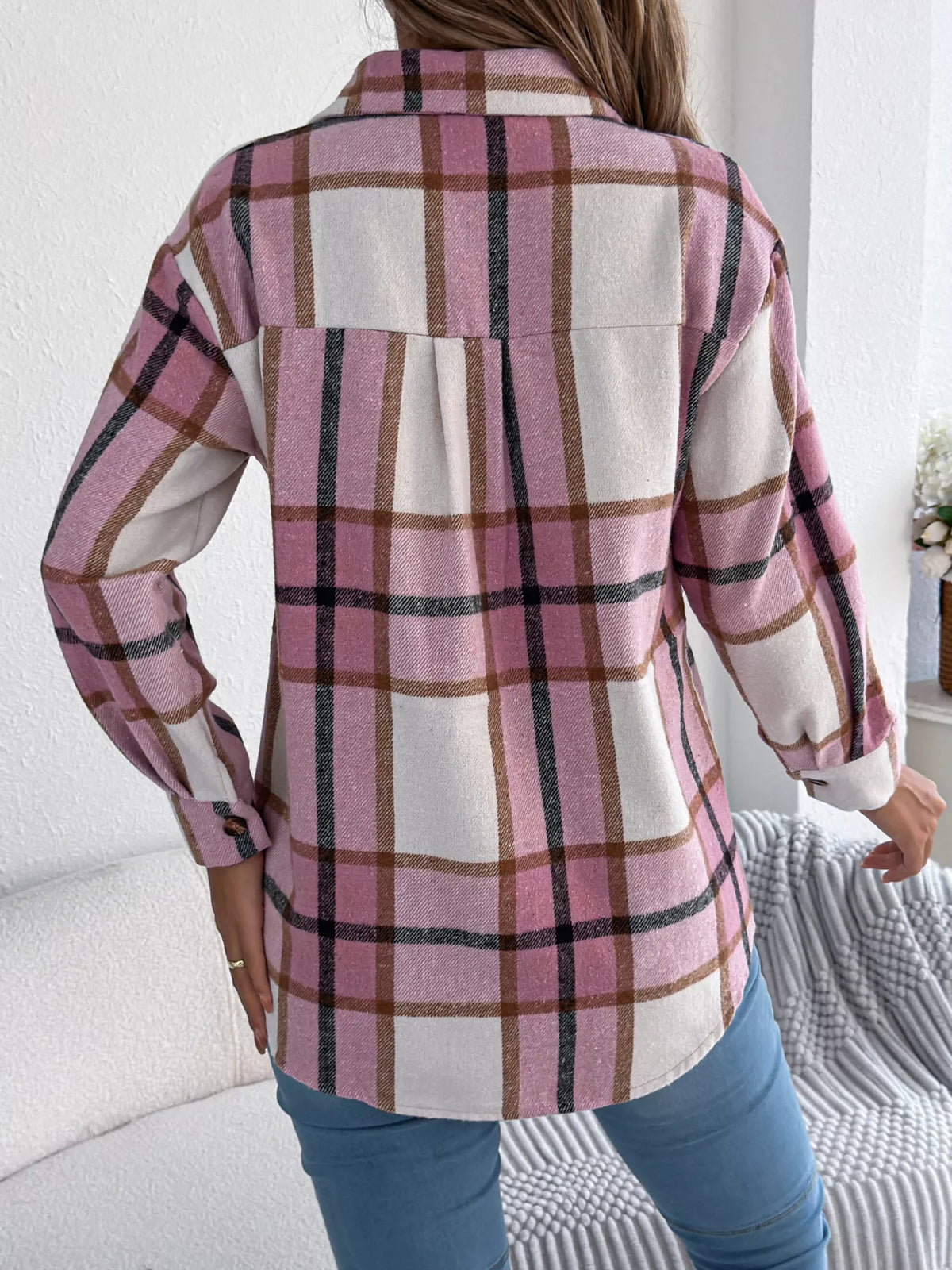 Pink plaid button-down shacket with chest pockets, back view.