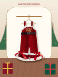 Red Santa Baby overalls with a black belt, white trim and bows at the flared legs.