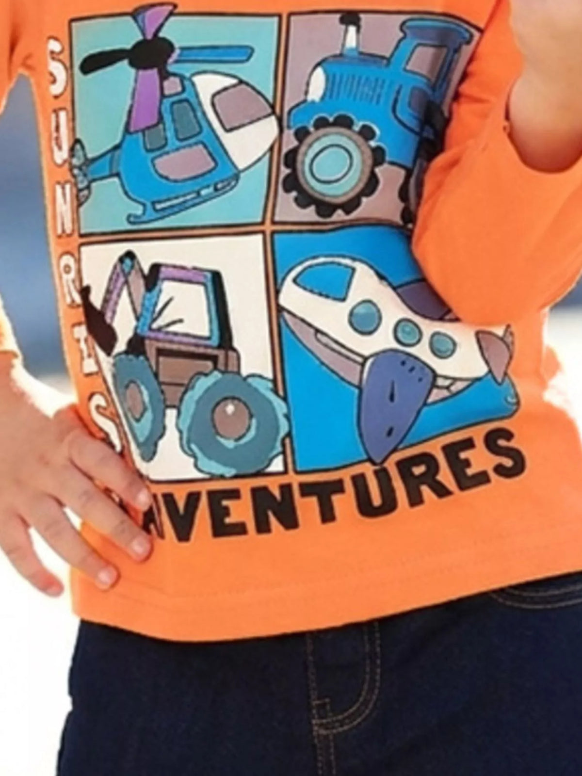 Close view of the vehicle graphic panels and Adventures lettering on the orange top.