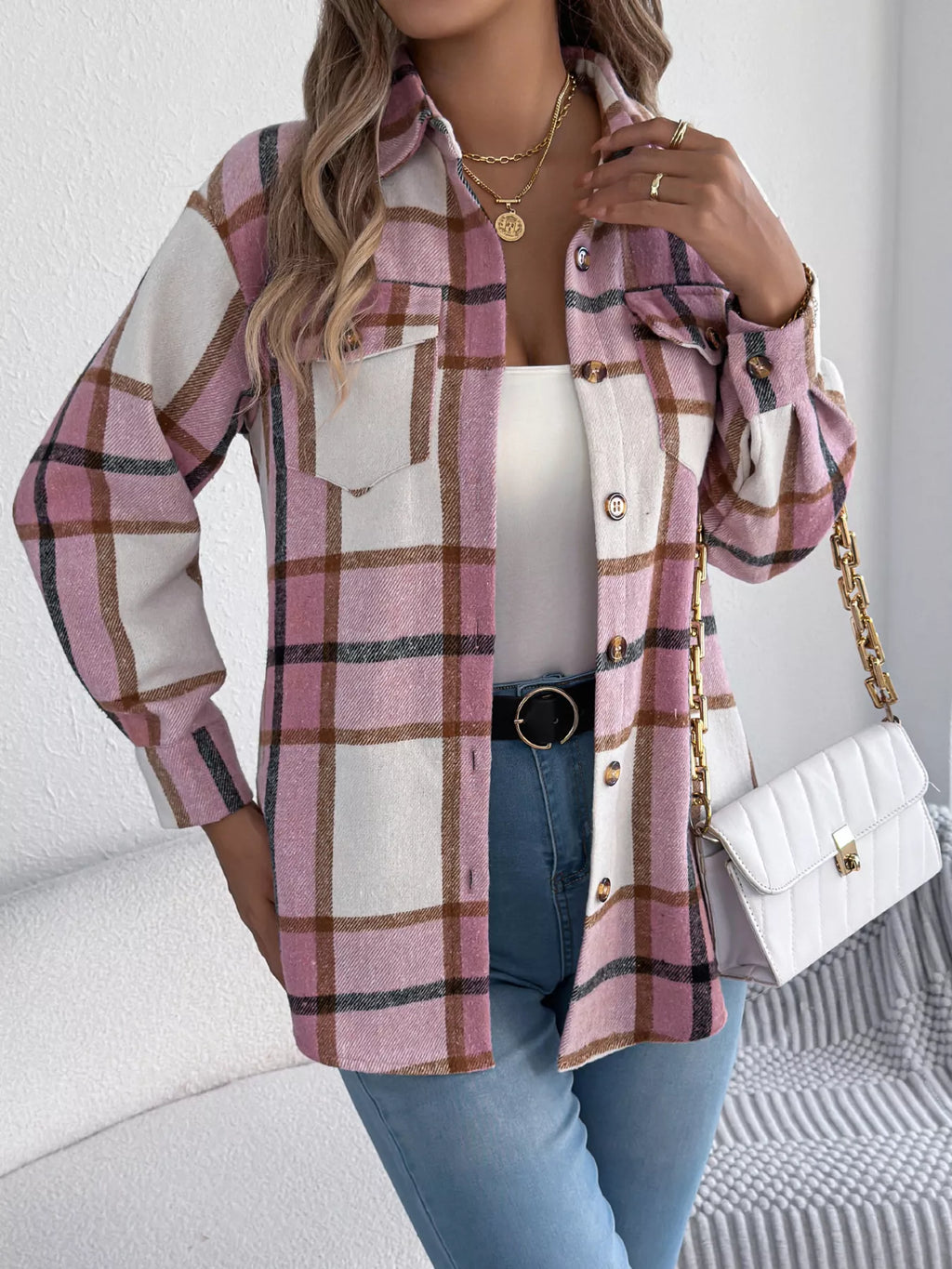 Pink plaid button-down shacket with chest pockets, front view.