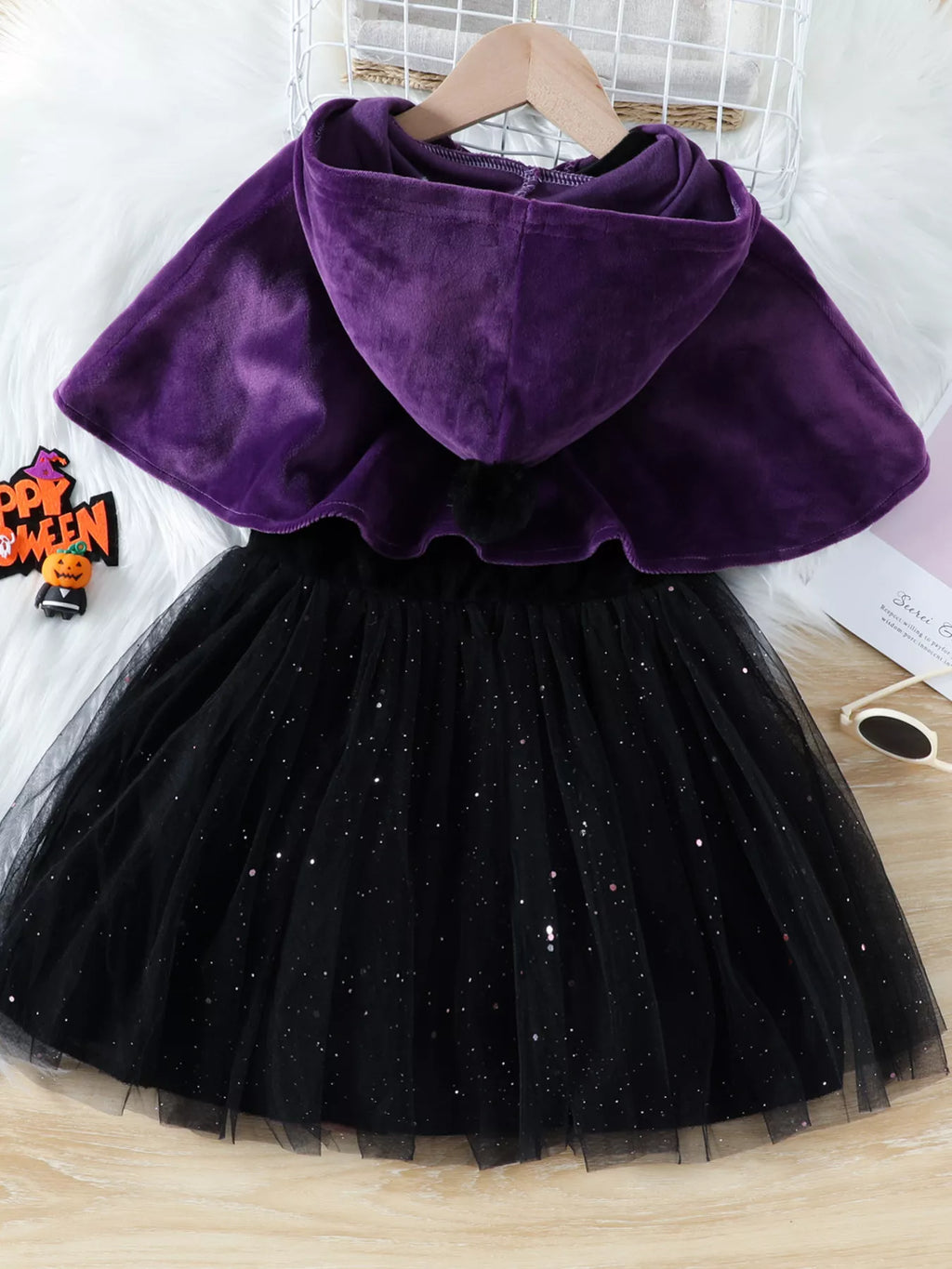 Back view of the purple hooded cape and black tulle skirt.