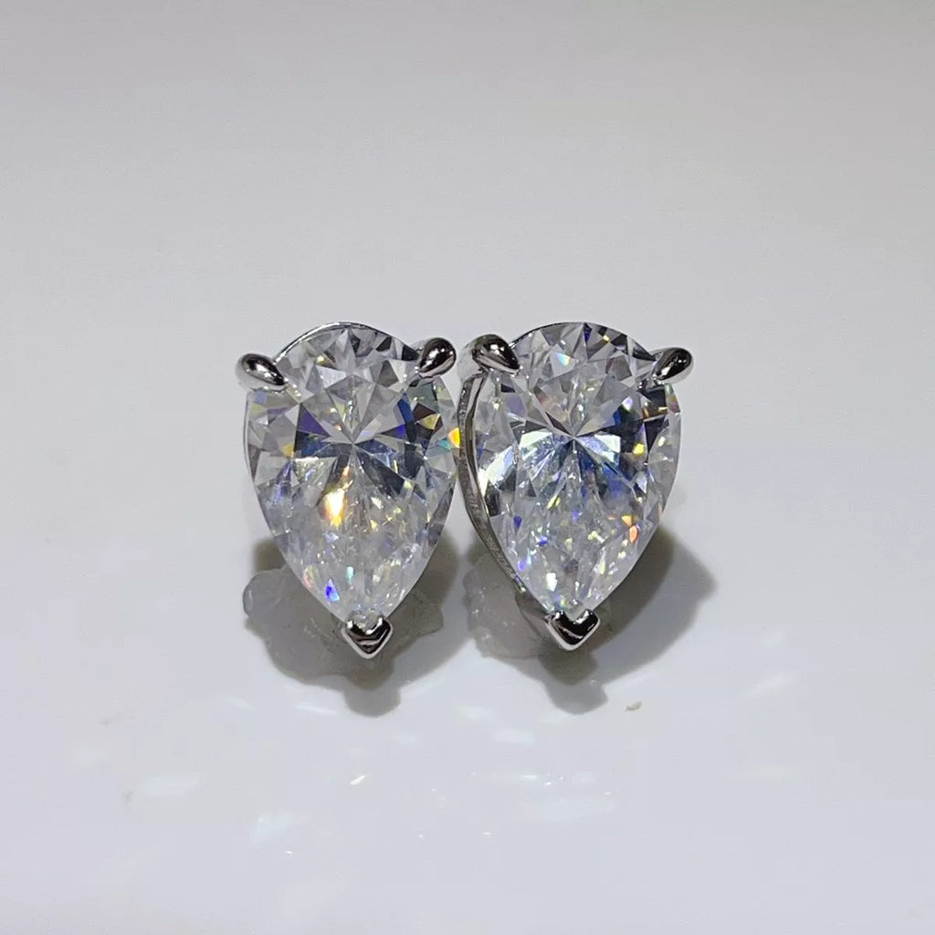 Silver-tone stud earrings with triangular clear stones — detail view