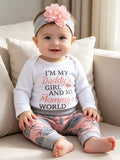 White letter graphic baby bodysuit, pink floral pants, flower headband and matching hat worn by a child