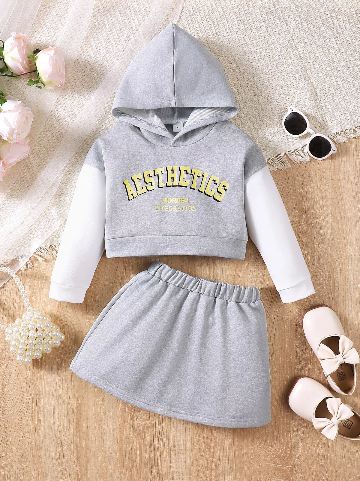 Children’s gray and white AESTHETICS graphic hoodie and gray skirt displayed flat