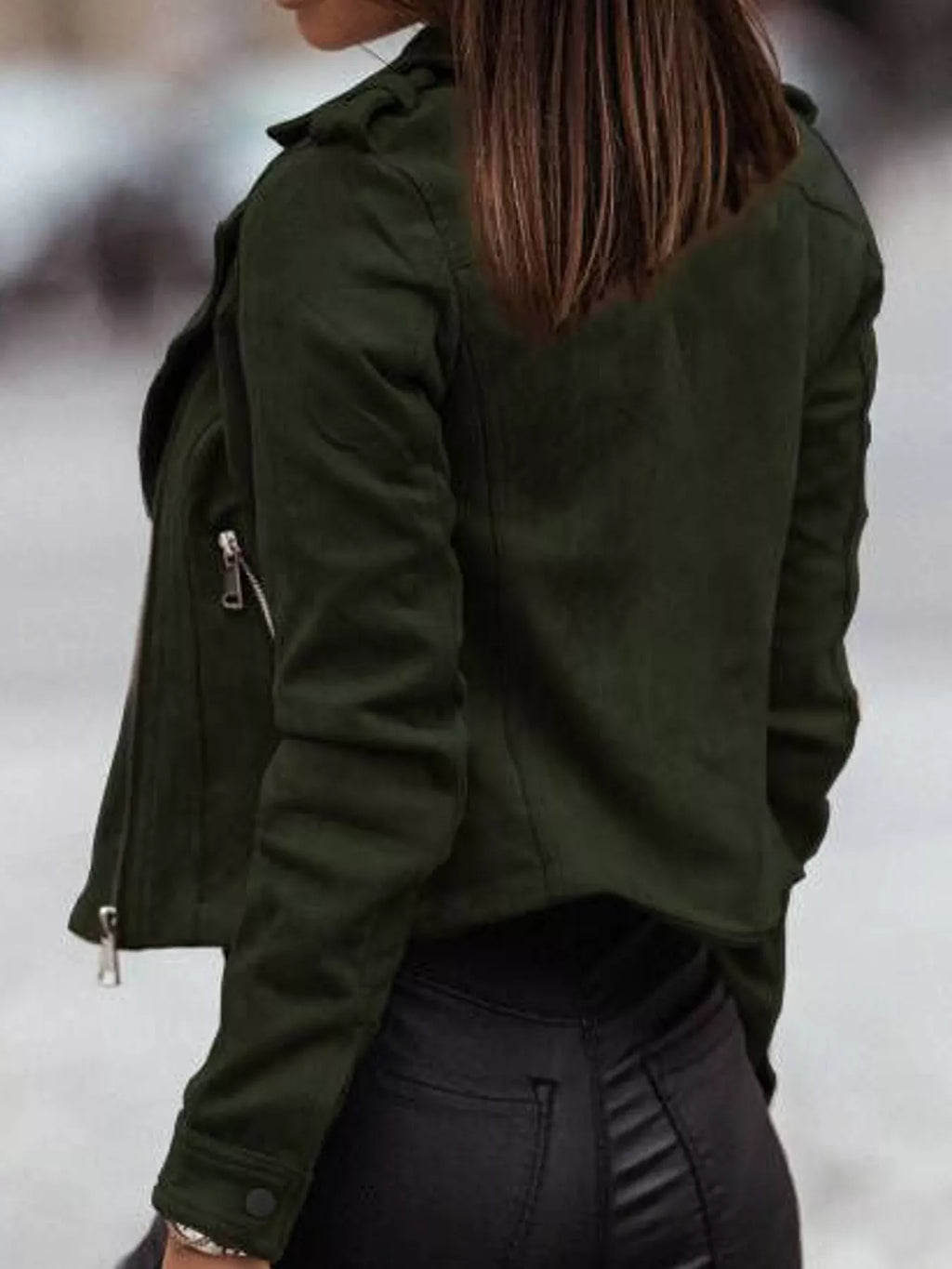 Back view of the green asymmetrical-zip jacket.