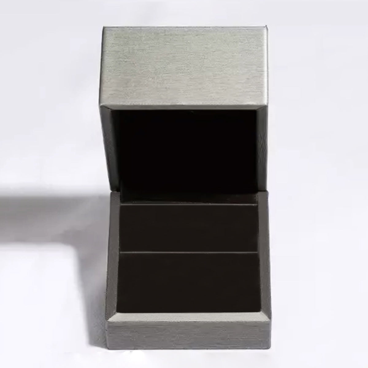 Open gray jewelry presentation box with black interior