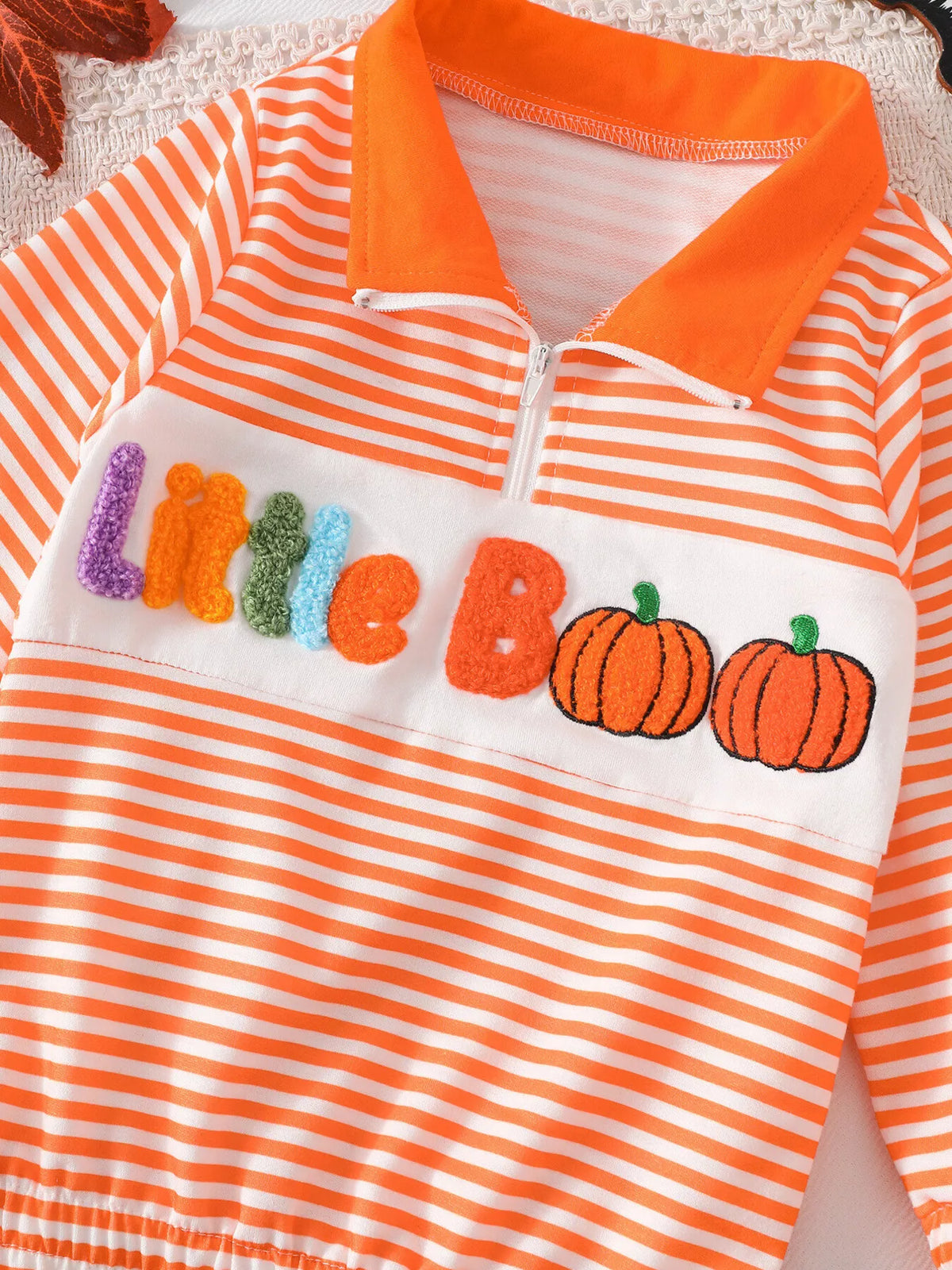 Front view of the orange striped Little Boo top with pumpkin graphics.