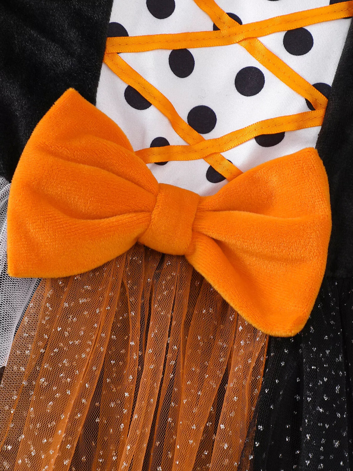 Close-up of the large orange waist bow on the Halloween tulle dress.
