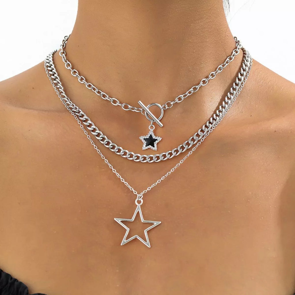 Three layered silver-tone necklaces with star pendants