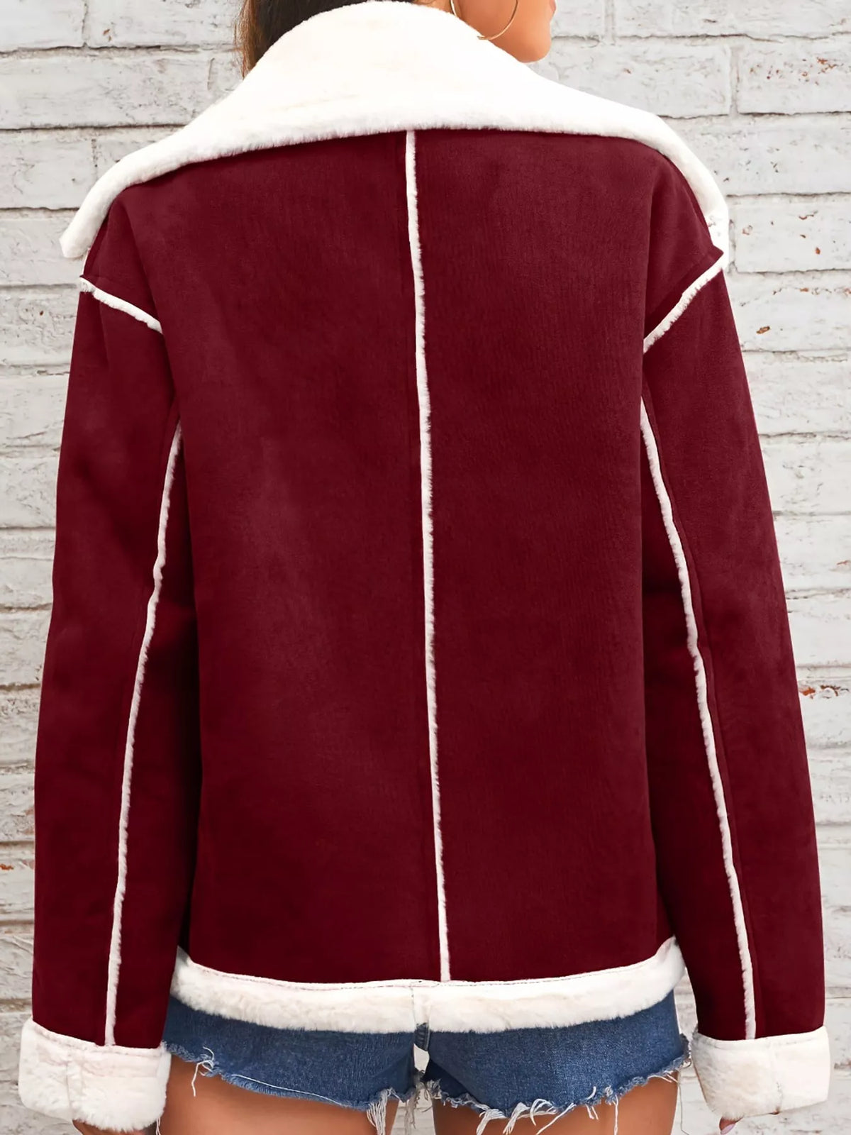 Crimson jacket with wide white plush lapels, contrast trim and front pockets, back view.